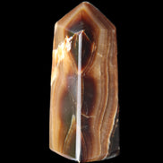 Chocolate Calcite obelisk 62*25*21mm 73g in sunlight - Rocks and Things Store