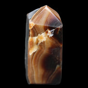 Chocolate Calcite obelisk 62*25*21mm 73g in sunlight - Rocks and Things Store