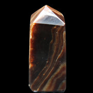Chocolate Calcite obelisk 62*25*21mm 73g in sunlight - Rocks and Things Store