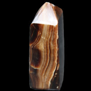 Chocolate Calcite obelisk 62*25*21mm 73g in sunlight - Rocks and Things Store