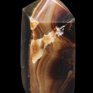 Chocolate Calcite obelisk 62*25*21mm 73g in sunlight - Rocks and Things Store