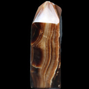 Chocolate Calcite obelisk 62*25*21mm 73g in sunlight - Rocks and Things Store