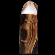 Chocolate Calcite obelisk 62*25*21mm 73g in sunlight - Rocks and Things Store