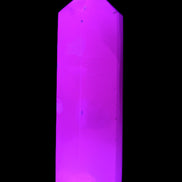 Mangano Calcite UV-reactive obelisk 92mm 157g in sunlight - Rocks and Things Store