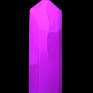 Mangano Calcite UV-reactive obelisk 92mm 157g in sunlight - Rocks and Things Store