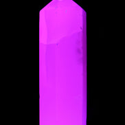 Mangano Calcite UV-reactive obelisk 92mm 157g in sunlight - Rocks and Things Store