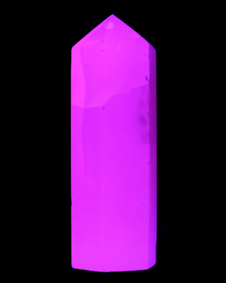 Mangano Calcite UV-reactive obelisk 92mm 157g in sunlight - Rocks and Things Store
