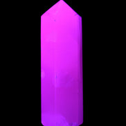 Mangano Calcite UV-reactive obelisk 92mm 157g in sunlight - Rocks and Things Store