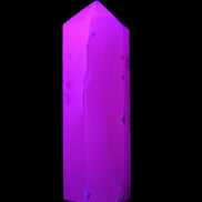 Mangano Calcite UV-reactive obelisk 92mm 157g in sunlight - Rocks and Things Store