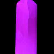 Mangano Calcite UV-reactive obelisk 92mm 157g in sunlight - Rocks and Things Store