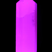 Mangano Calcite UV-reactive obelisk 92mm 157g in sunlight - Rocks and Things Store