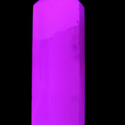 Mangano Calcite UV-reactive obelisk 92mm 157g in sunlight - Rocks and Things Store