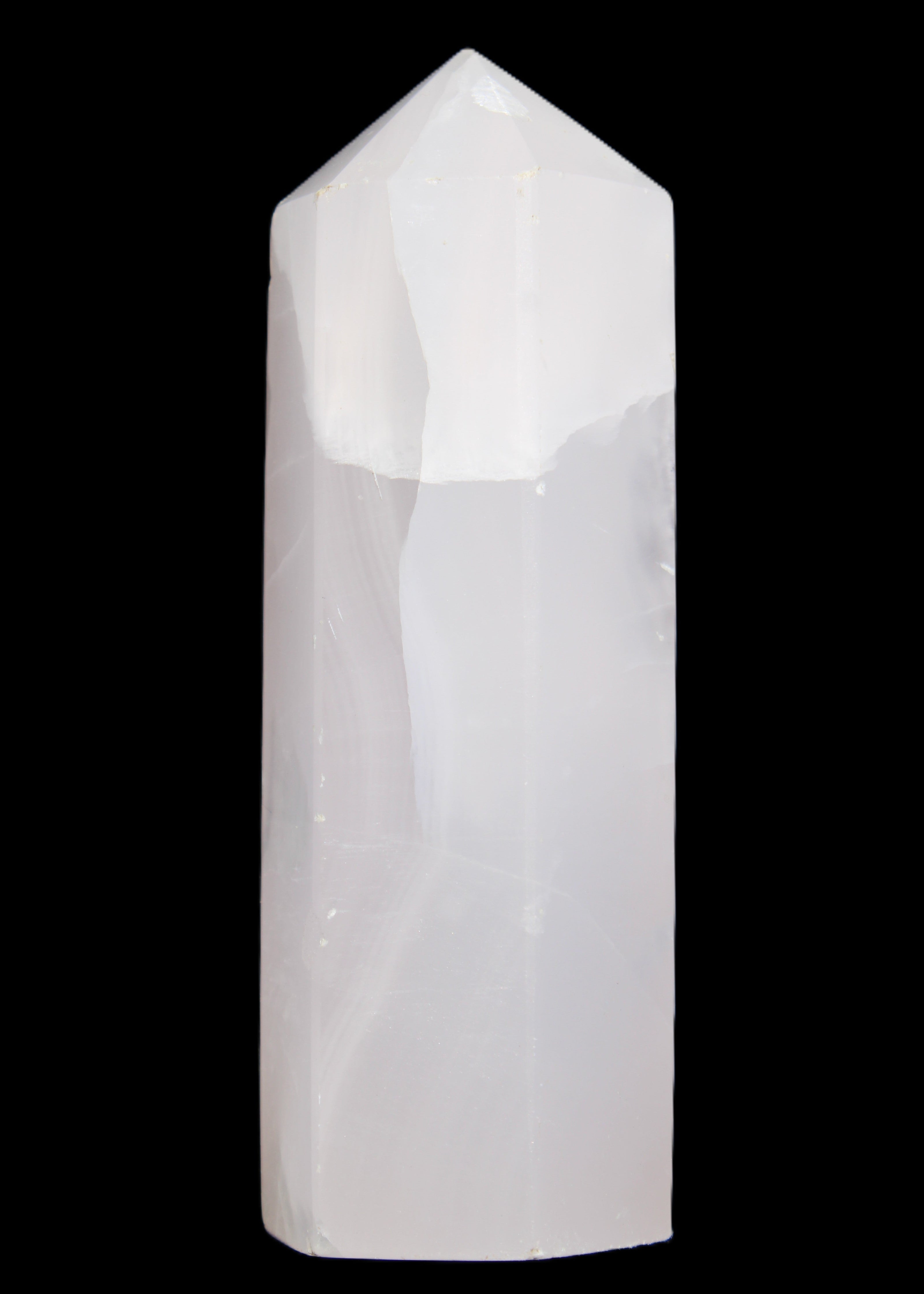 Mangano Calcite UV-reactive obelisk 92mm 157g in sunlight - Rocks and Things Store