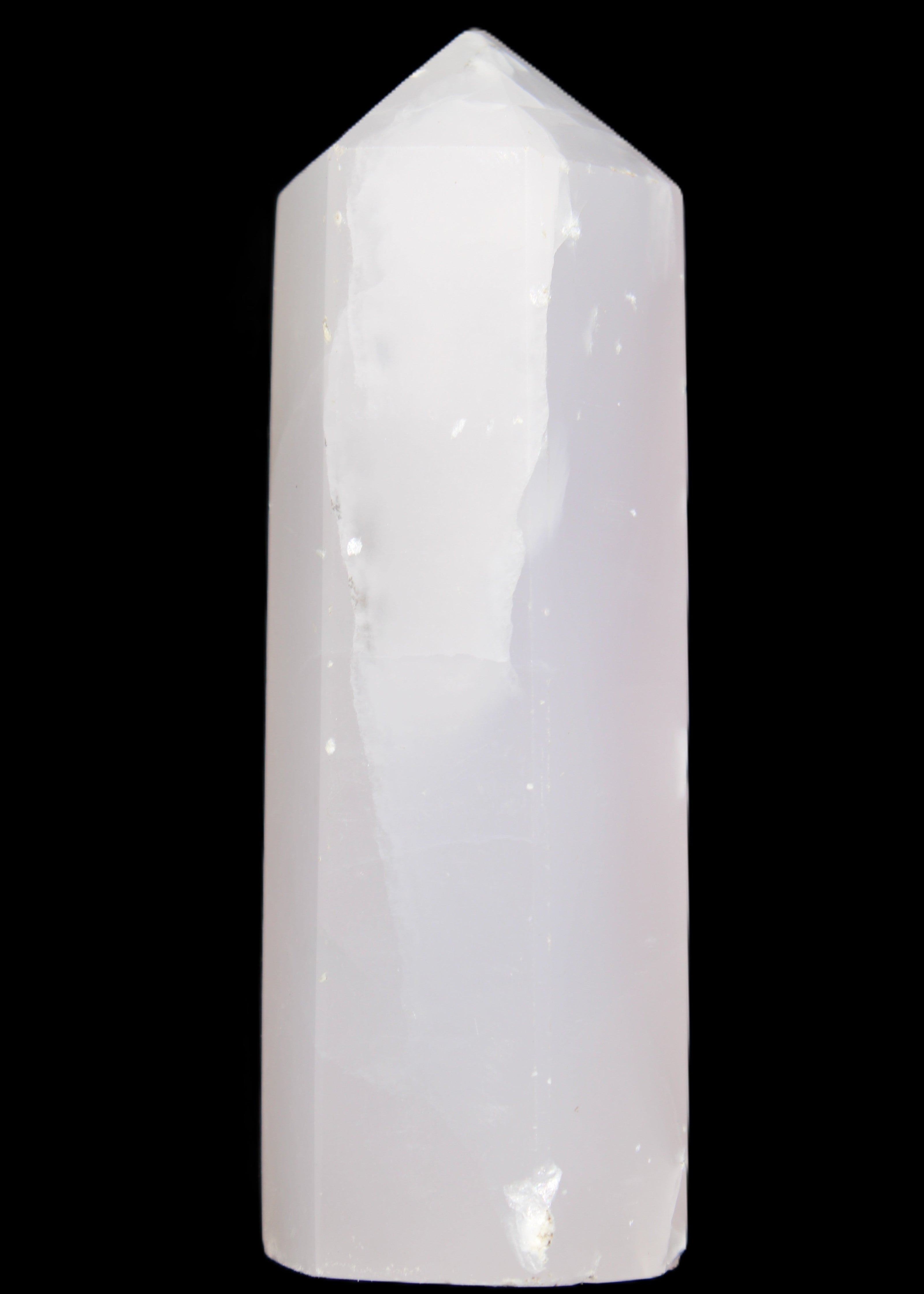 Mangano Calcite UV-reactive obelisk 92mm 157g in sunlight - Rocks and Things Store