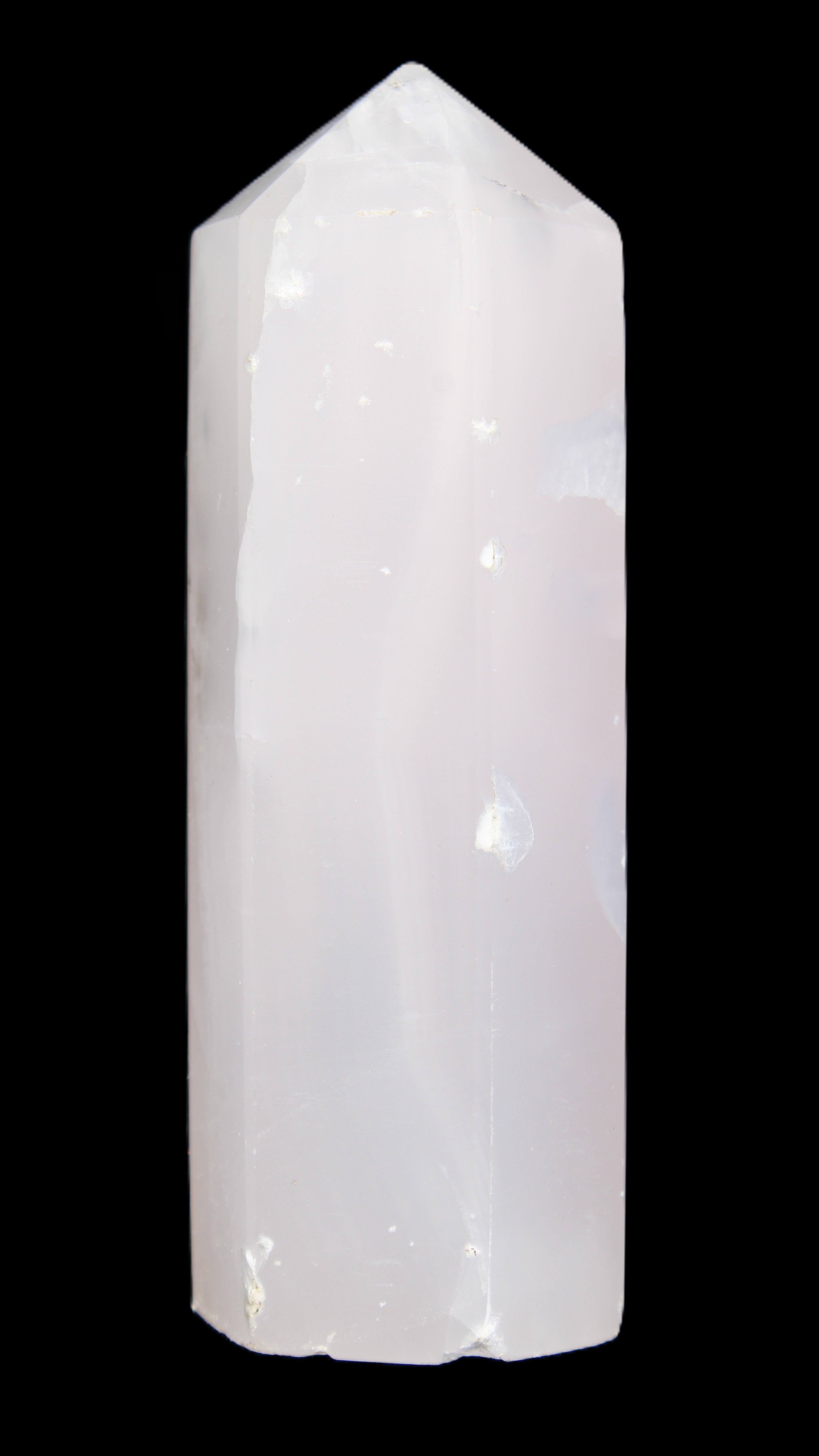 Mangano Calcite UV-reactive obelisk 92mm 157g in sunlight - Rocks and Things Store