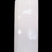 Mangano Calcite UV-reactive obelisk 92mm 157g in sunlight - Rocks and Things Store