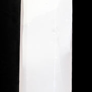 Mangano Calcite UV-reactive obelisk 92mm 157g in sunlight - Rocks and Things Store