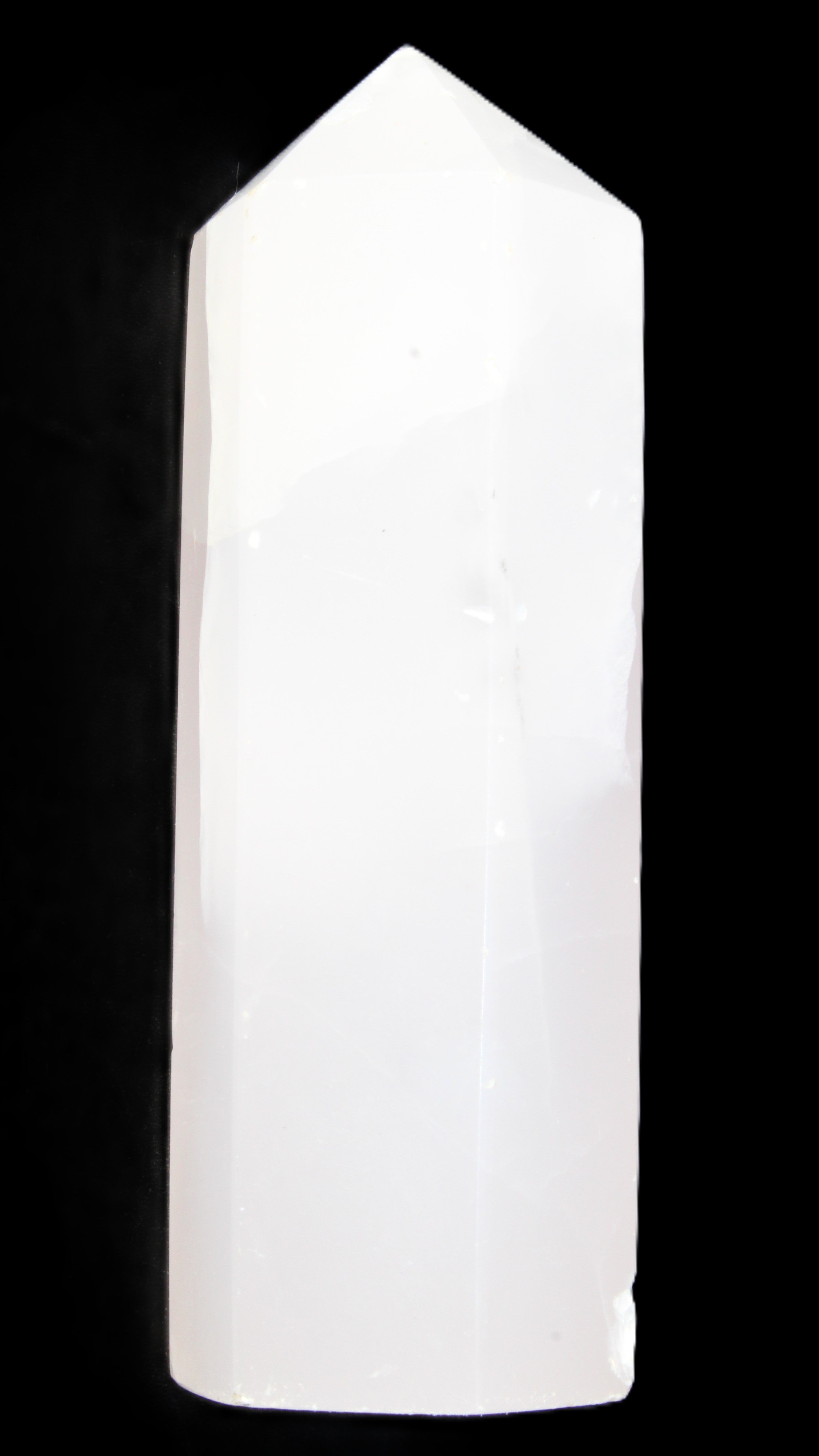 Mangano Calcite UV-reactive obelisk 92mm 157g in sunlight - Rocks and Things Store