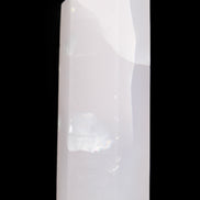 Mangano Calcite UV-reactive obelisk 92mm 157g in sunlight - Rocks and Things Store