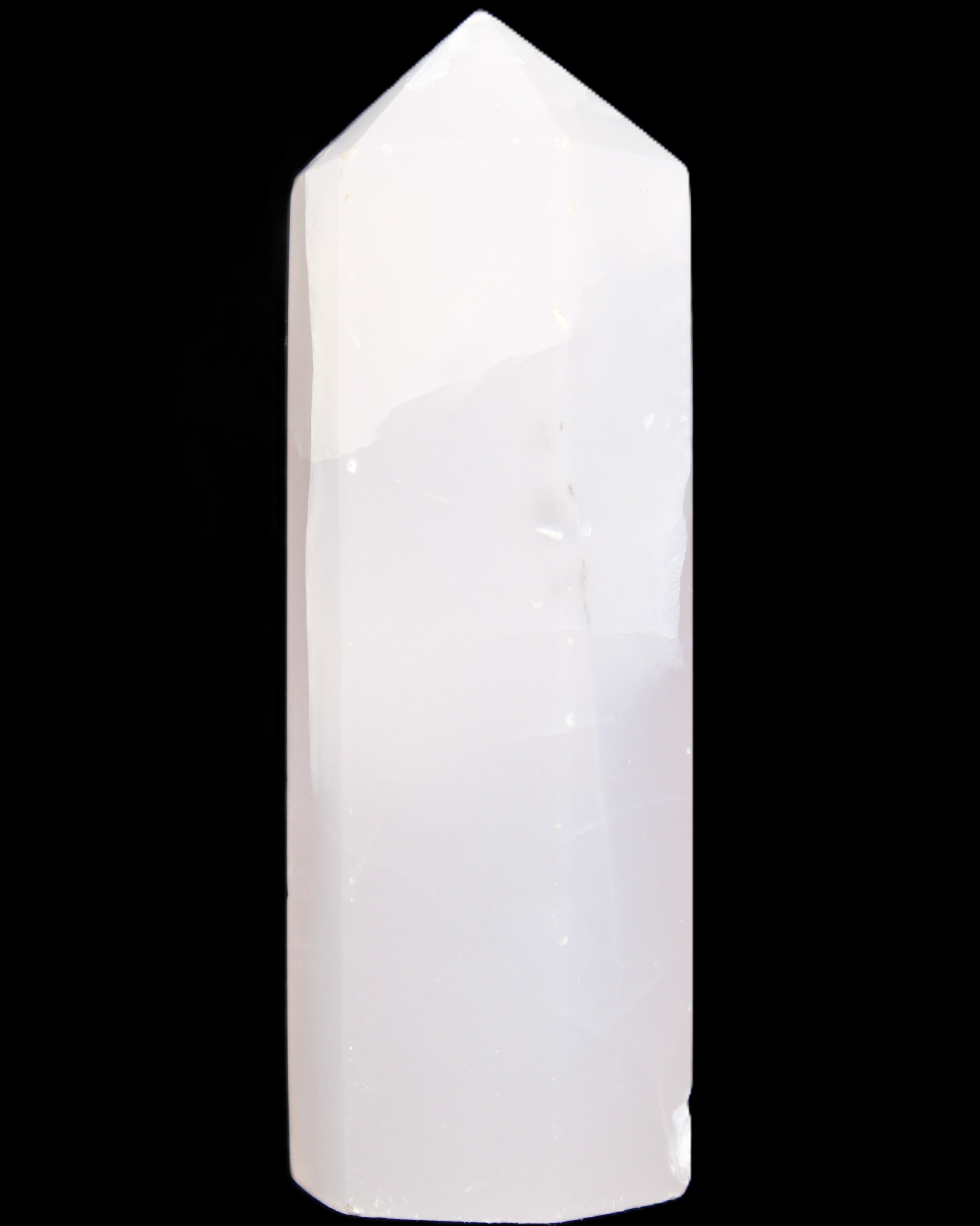 Mangano Calcite UV-reactive obelisk 92mm 157g in sunlight - Rocks and Things Store