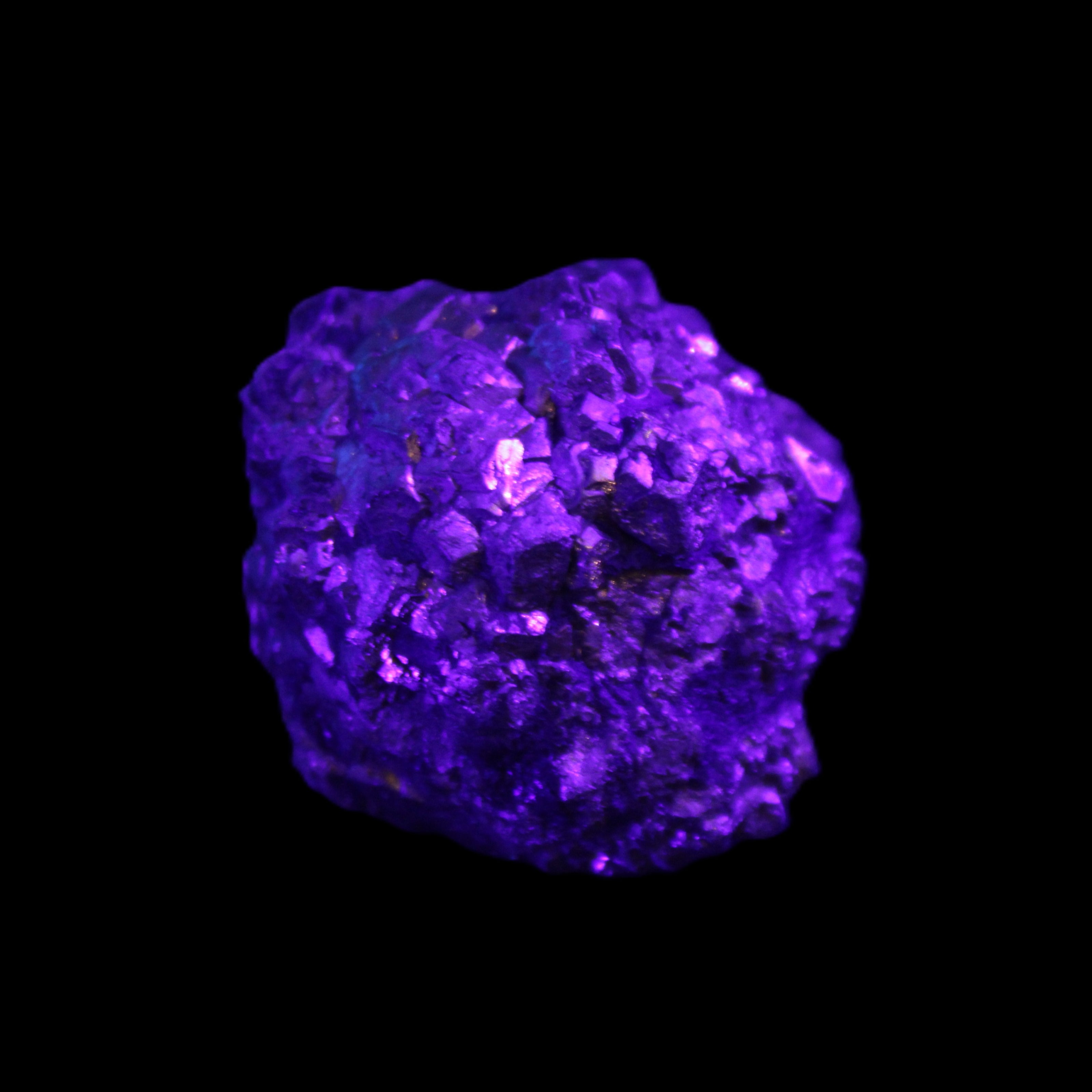 Chalcopyrite cluster from Pakistan 40*32*32mm 95g in UV light - Rocks and Things Store