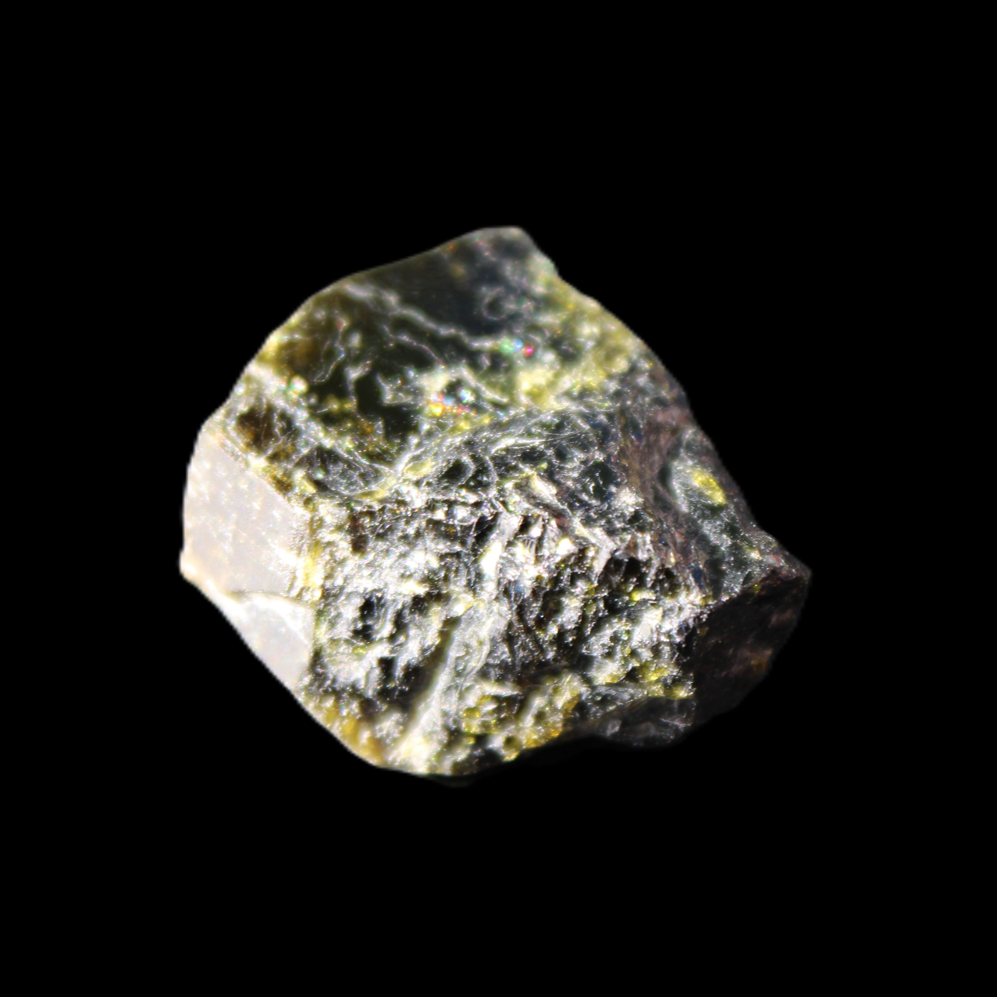 Magnetic Epidote glossy irregular hexagon crystal 20mm 9-11g in sunlight - Rocks and Things Store