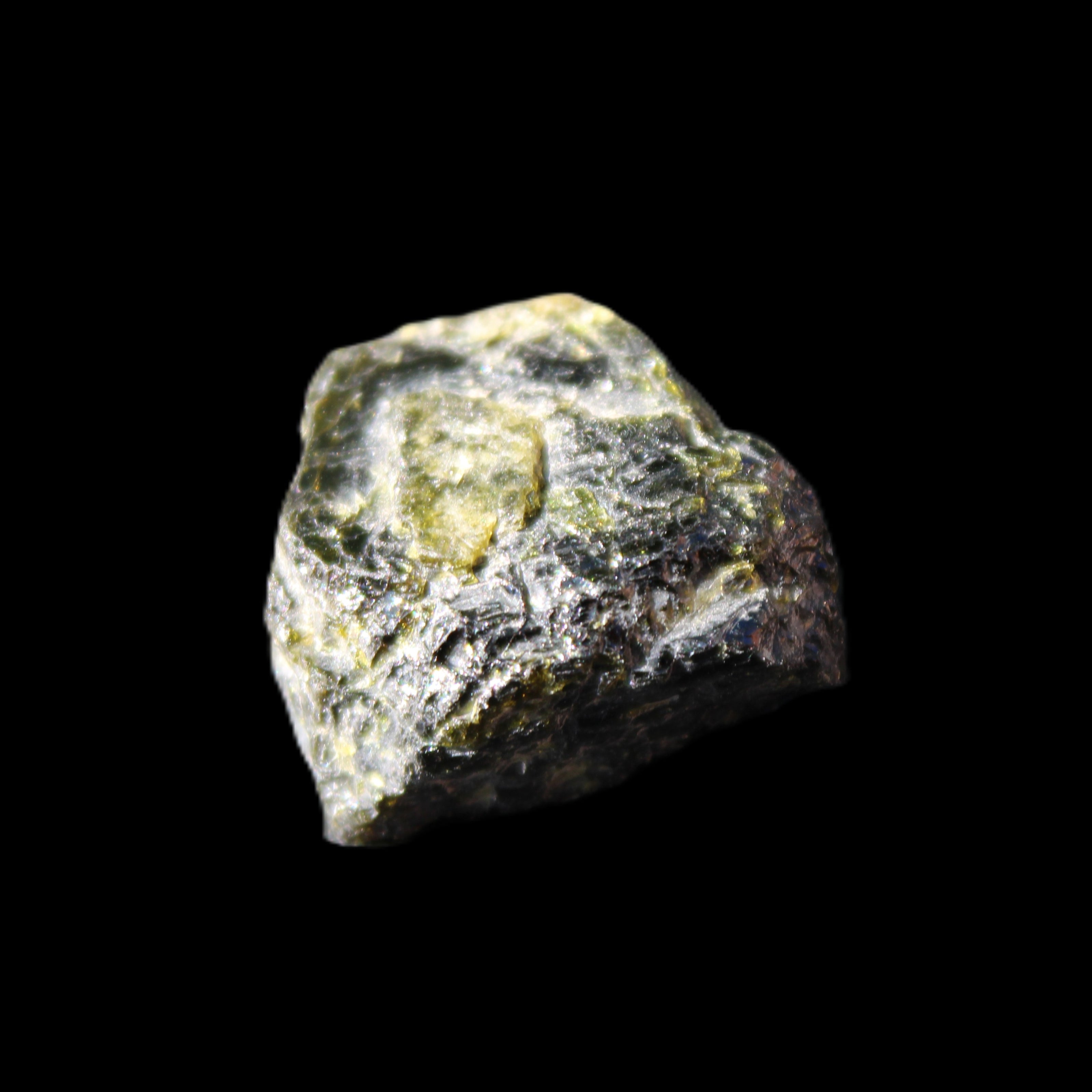 Magnetic Epidote glossy irregular hexagon crystal 20mm 9-11g in sunlight - Rocks and Things Store