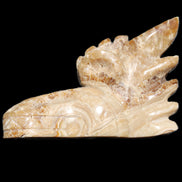 Chocolate Calcite Dragon's head hand-carved 118*41*85mm 494g in sunlight - Rocks and Things Store