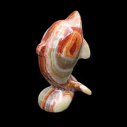 Colouful Afghan Jade Leaping Dolphin hand-carved 83*53*33mm 184g in sunlight - Rocks and Things Store