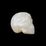 Honey Calcite skull hand-carved 53*46*32mm 143g in sunlight - Rocks and Things Store