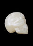 Honey Calcite skull hand-carved 53*46*32mm 143g in sunlight - Rocks and Things Store