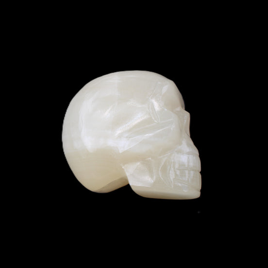 Honey Calcite skull hand-carved 53*46*32mm 143g in sunlight - Rocks and Things Store
