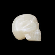 Honey Calcite skull hand-carved 53*46*32mm 143g in sunlight - Rocks and Things Store