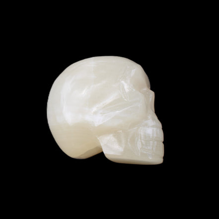Honey Calcite skull hand-carved 53*46*32mm 143g in sunlight - Rocks and Things Store