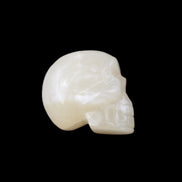 Honey Calcite skull hand-carved 53*46*32mm 143g in sunlight - Rocks and Things Store