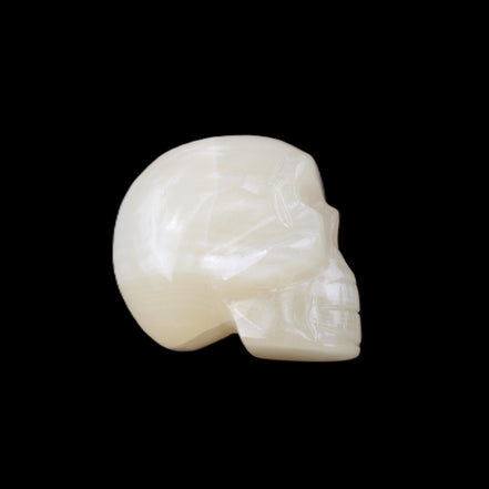 Honey Calcite skull hand-carved 53*46*32mm 143g in sunlight - Rocks and Things Store
