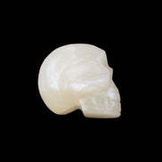 Honey Calcite skull hand-carved 53*46*32mm 143g in sunlight - Rocks and Things Store