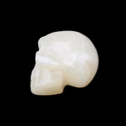 Honey Calcite skull hand-carved 53*46*32mm 143g in sunlight - Rocks and Things Store
