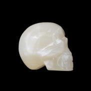 Honey Calcite skull hand-carved 53*46*32mm 143g in sunlight - Rocks and Things Store