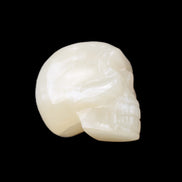 Honey Calcite skull hand-carved 53*46*32mm 143g in sunlight - Rocks and Things Store