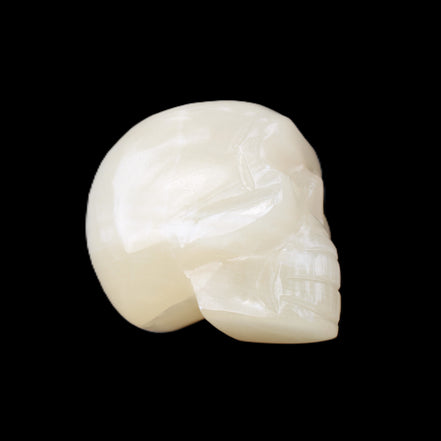 Honey Calcite skull hand-carved 53*46*32mm 143g in sunlight - Rocks and Things Store