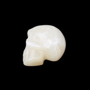 Honey Calcite skull hand-carved 53*46*32mm 143g in sunlight - Rocks and Things Store
