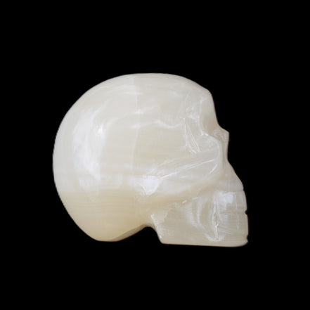 Honey Calcite skull hand-carved 53*46*32mm 143g in sunlight - Rocks and Things Store