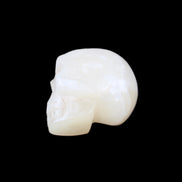 Honey Calcite skull hand-carved 53*46*32mm 143g in sunlight - Rocks and Things Store