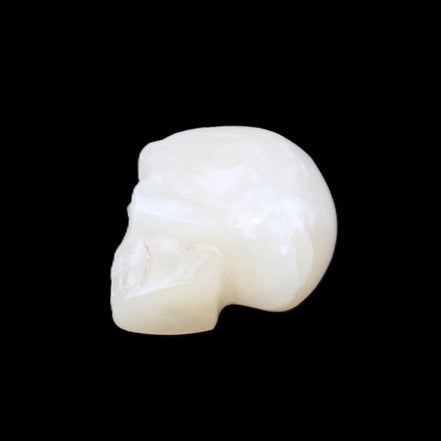 Honey Calcite skull hand-carved 53*46*32mm 143g in sunlight - Rocks and Things Store