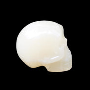 Honey Calcite skull hand-carved 53*46*32mm 143g in sunlight - Rocks and Things Store
