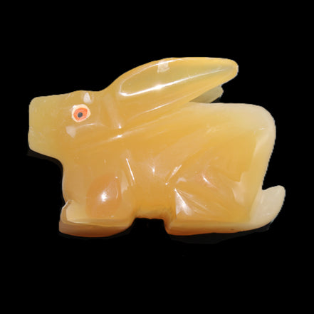 Honey Calcite bunny hand-carved 102*67*52mm 477g in sunlight - Rocks and Things Store