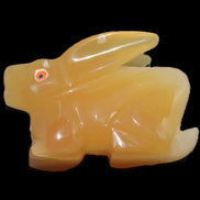 Honey Calcite bunny hand-carved 102*67*52mm 477g in sunlight - Rocks and Things Store