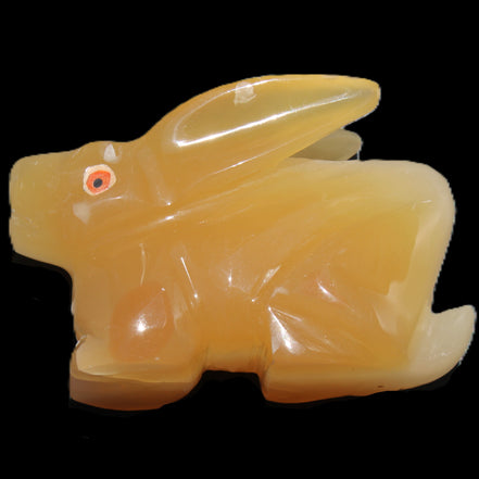 Honey Calcite bunny hand-carved 102*67*52mm 477g in sunlight - Rocks and Things Store