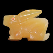 Honey Calcite bunny hand-carved 102*67*52mm 477g in sunlight - Rocks and Things Store